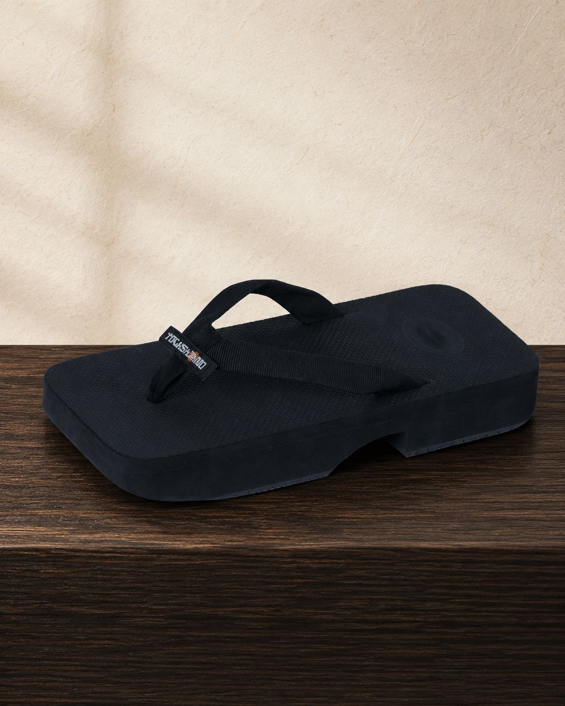 Three-quarter — the strap arc and the stepped platform read together at an angle